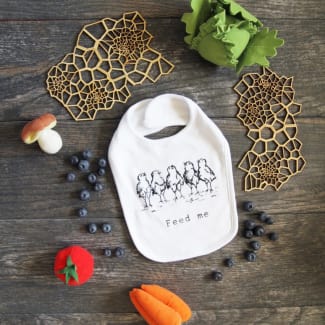 Feed Me Cotton Funny Baby Bib, white with black lettering, by The Coin Laundry