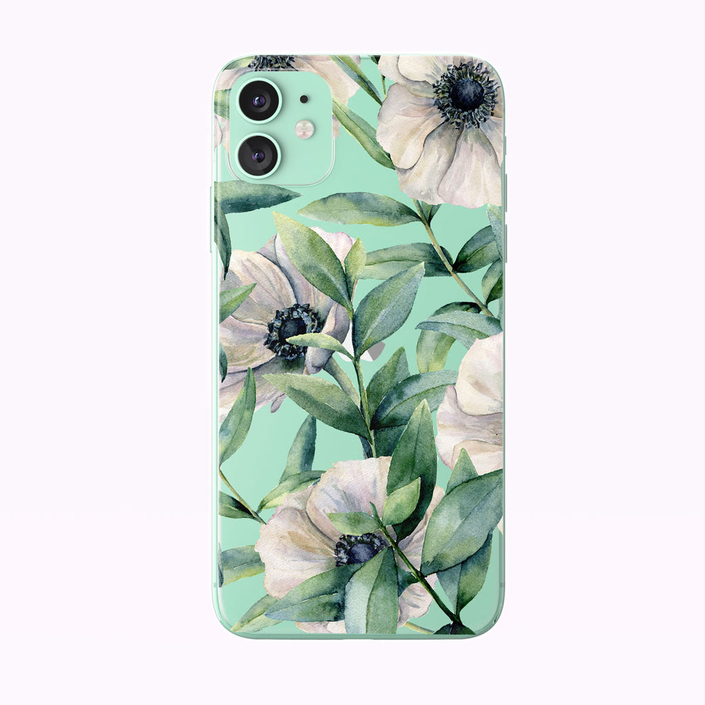 Watercolor White Anemones and Eucalyptus Clear iPhone Case from Tiny Quail shown on green iPhone