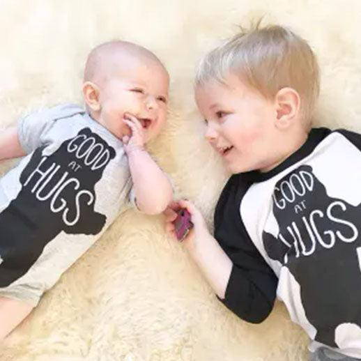 Baby and Toddler wearing Good at Hugs Cute Baby Bodysuit 6 Months by The Coin Laundry